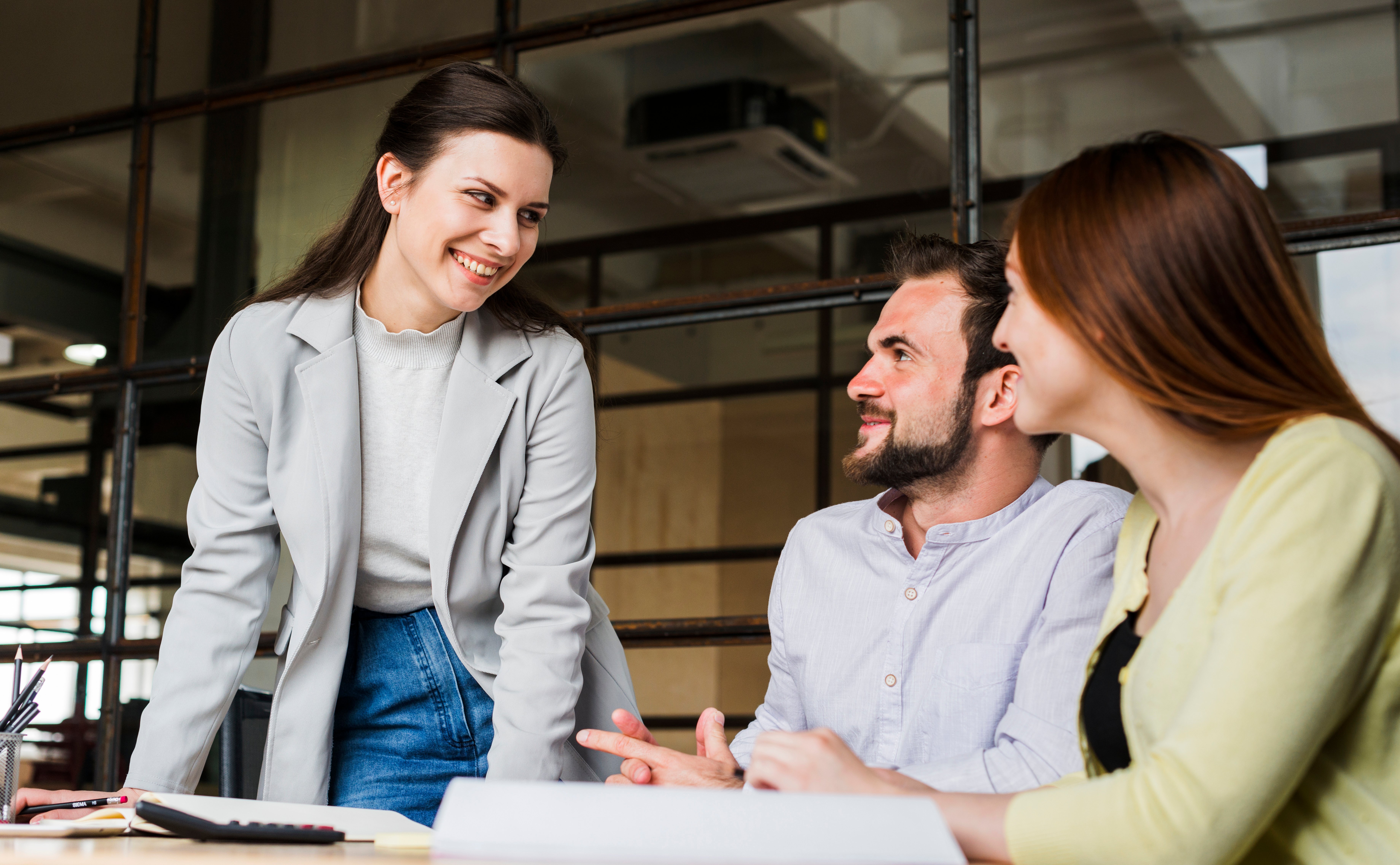 smiling-businesspeople-working-together-office